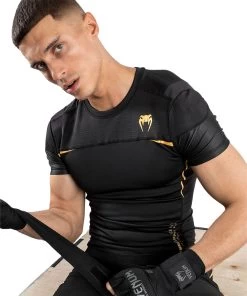 Venum Tempest 2.0 Rashguard - Short Sleeves - MMA Factory -Boxing Equipment Store a3ed9a46c01aa5a5cb77b5dd5f3826325bebac17 rashguards ss tempest2.0 black gold 06 1.5